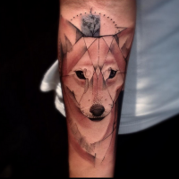 Geometrical style colored forearm tattoo of fox head