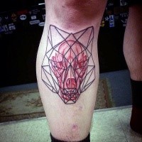 Geometrical style colored leg tattoo of animal skull with figures