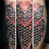 Geometrical style painted and colored owl tattoo on leg