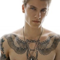 Giant feather wings and sand clock black ink tattoo on man's chest