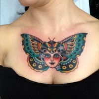 Girl head moth butterfly tattoo on chest