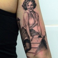 Girl hammer nails pin up tattoo by Xavier Garcia