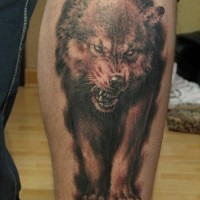 Gnarling wolf tattoo on the foot