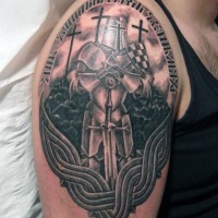 Gorgeous black and white Celtic shoulder tattoo of medieval knight with lettering