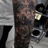 Gorgeous black ink old steamy train with clock tattoo on arm