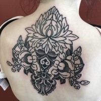Gorgeous black ink upper back tattoo of beautiful ornamental picture