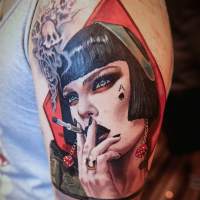 Gorgeous designed and colored shoulder tattoo of smoking woman with funny smoke