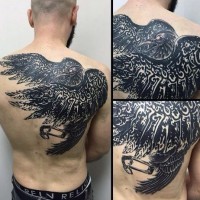 Gorgeous designed massive tribal crow tattoo on upper back