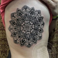 Gorgeous detailed black ink side tattoo of beautiful flower