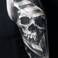 Gorgeous glass like black and white skull tattoo on upper arm