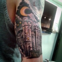 Gorgeous multicolored fantasy castle with moon tattoo on half sleeve area