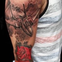 Gorgeous realism style colored sleeve tattoo of modern fighter plane and rose flower