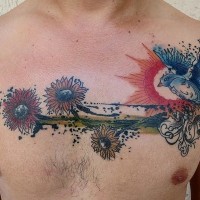 Gorgeous watercolor style painted wildflowers tattoo on chest combined with nice flying bird