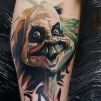 Graffiti style colored leg tattoo of creepy alien face