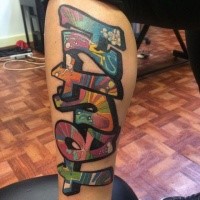 Graffiti style colored leg tattoo of funny lettering