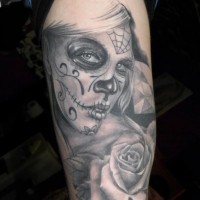 Gray ink day of the dead tattoo on arm