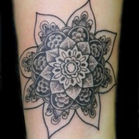Gray-ink mandala flower tattoo on arm