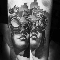 Gray washed colored forearm tattoo of woman portrait in interesting mask