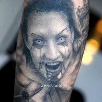 Gray washed horror style forearm tattoo of bloody woman portrait