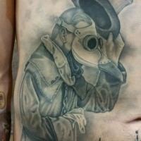 Gray washed style amazing looking belly tattoo of plague doctor with lettering