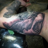 Gray washed style big biceps tattoo of evil shark