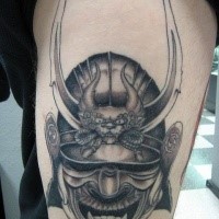 Gray washed style big detailed thigh tattoo of samurai warrior helmet