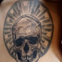 Gray washed style black ink side tattoo fo human skull with ornament