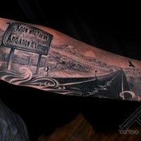 Gray washed style colored forearm tattoo of American road with sign