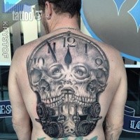 Gray washed style colored whole back tattoo of clock with human skulls and woman faces