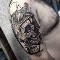 Gray washed style cool looking shoulder tattoo of bikers skull