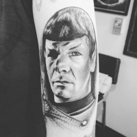 Gray washed style cool looking shoulder tattoo of Spock portrait