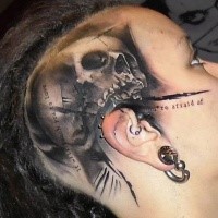 Gray washed style detailed head tattoo of human skull part with lettering