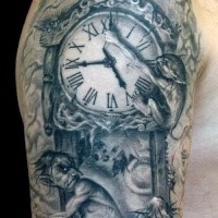 Gray washed style detailed shoulder tattoo of clock stylized with demons