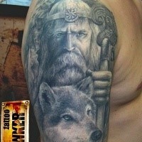 Gray washed style detailed shoulder tattoo of wizard with wolf