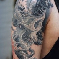 Gray washed style detailed shoulder tattoo of human skull stylized with forest and deer