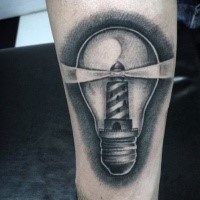 Gray washed style forearm tattoo of bulb stylized with lighthouse