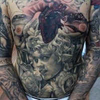 Gray washed style large Medusa head tattoo on belly combined with rose flowers