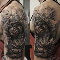 Gray washed style shoulder tattoo of ancient Aztec warrior with flower