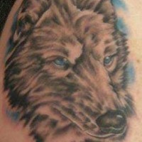 Gray wolf with blue eyes tattoo