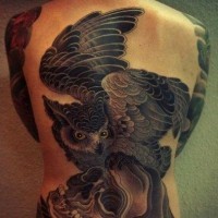 Great awesome owl with skull tattoo on back