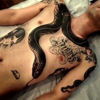 Amazing black snake tattoo on chest