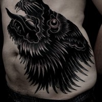 Great black wolf tattoo on ribs