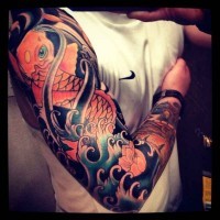 Great colorful koi fish tattoo on whole arm