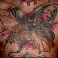 Great coloured bug tattoo on chest