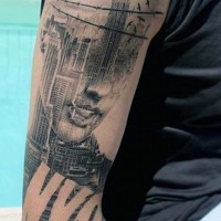 Great combined womans portrait with big American city tattoo on arm