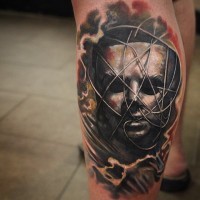 Great designed and colored big mystical mask tattoo on leg