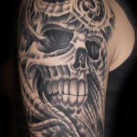 Great detailed black and white Alien skeleton tattoo on shoulder