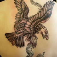 Great eagle with snake tattoo on back by Jam Tat