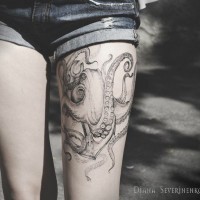 Great painted and detailed black and white octopus tattoo on thigh