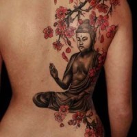 Great painted big Buddha statue under the tree tattoo on back